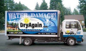A truck with the words " water damage !" on it.
