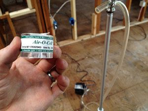 A person holding up a can of air-o-cell.