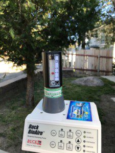 A thermometer sitting on top of a box.